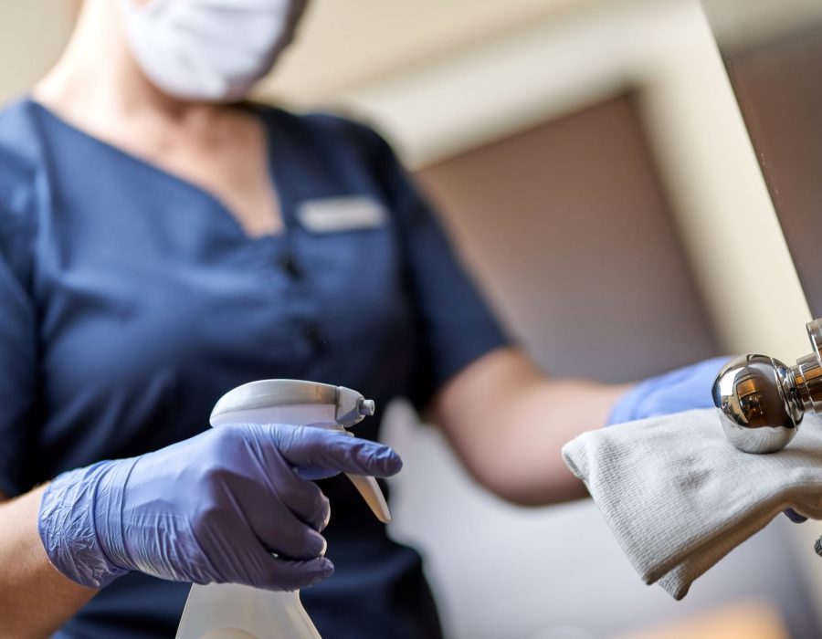 Cropped photo of chambermaid wearing gloves and wiping the door handle with a special disinfectant. Hotel service concept SSUCv3H4sIAAAAAAAACpxUy47bMAy8F+g/BDrXgN6S+ytFD5IlJ8I6VmDL2y4W+++lH3LkbNpDL0E8Q5HUkKP3r19OJ2TNGBr0/fQ+f8F36LppTINJIfYA428bPvje+aFEXgcmcQl4F1IcgulK0JrUXHpz9QD2U9fN8MdCojGZNI1+LKqPlyklP4wpNi8As5zFuGj9Z7Qz17cScP4Wx5Bul5jieCAGb65jCksbO3qLvRMHIPxOpgQIZUNbAjaclzaWEkCQTLSD97dwaO/NvF1DMyxhxbUbk/wZdDpcPI/hx/p9ysRCwgmgENoSr0pNdsEytCb/r5Prn5+7qmffN7Os7x9F14PvvFmHtfWIpHeNUJpWDaOy4l7VlSWcVaxpG+80k16rXBl53jRU1nVFqOAVd9JU2lpfWeOIsA1prW6XltY+0Msv2IPrItHWgZlciIVkr7Ex3TLlos3bEJrQn4tjMV2Wvc3Hmjj1aZjvhyip9/66GG/GdvN+tJDWZ/xixhFOuIyXgwSjxGtRqo9pEWjTGzmY9PxJGNVEMk5VrWpONN/Kbg64BMizdJR7nG5dNM7PRfdpPnqDSAypGCF0H+7RJjlAySJgc0zm6ry/T8yzxxQFDj56FpAttXN1wW3u2jhK1J3LRts4zovGPnlujZFc32Pu9gOhMRwXtMheOlEyRWBrCV7Z7JvZFtcAAh9F/6QoFUoQ8W/V5hhKn1/8kXsy1TmE0+faLJz8x0AgQDP8fCAzp/jzbWBMKMn/KqhmDGfFDk84tB1c+ZIdFENM11RrwdhutEfBEKdUcwwl9pCsF5I1U1yq+yvyoBYCL4GaohZiD8lqoTE43/XhJb5STDAUIPc8B9kQxVgKDItx72BTDRHorsaCyp3KoiFuWq6ocxXW8MMFtpUhoq2oodY64plp2/3UXU4EpmNMKs6X524TMsxrh4xQWMPzUBFiTcWJJJWVnFQcFPKUUOWxgVMffwAAAP//AwDuL4XZuwcAAA==